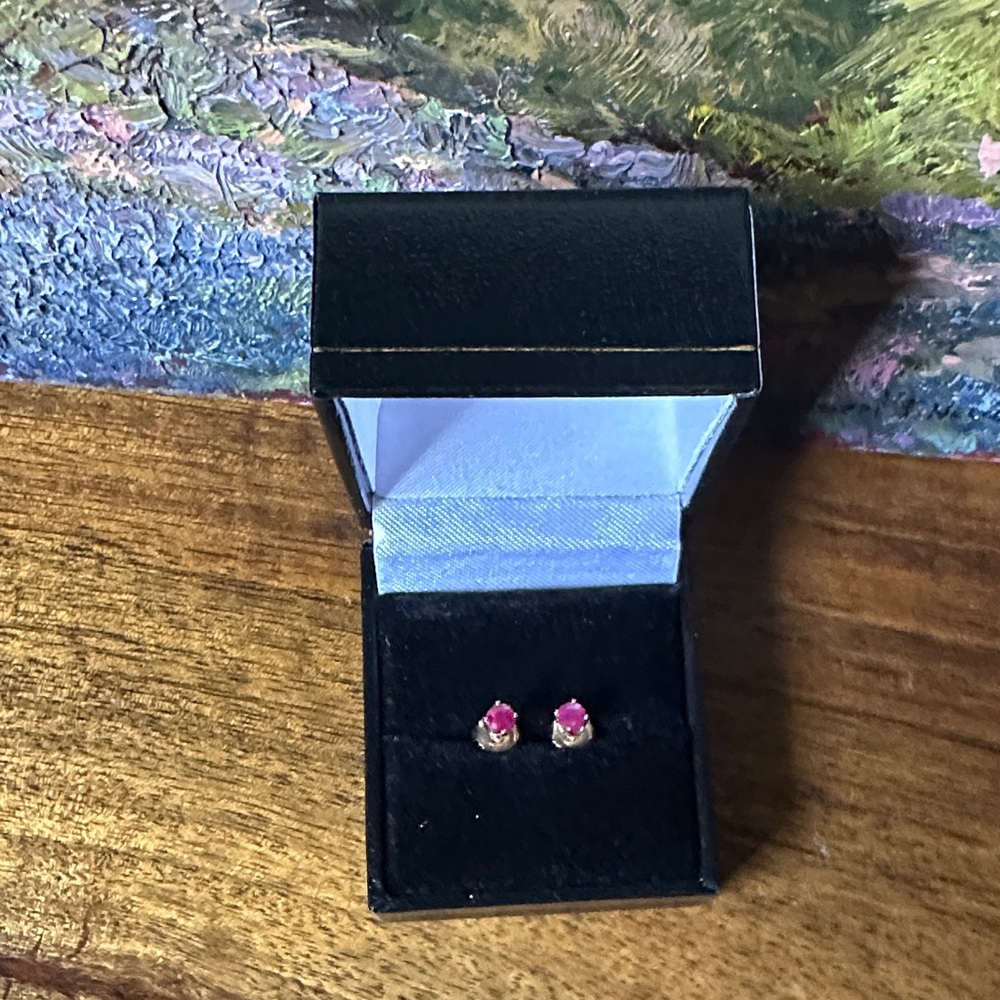 Elegant natural round cut RUBY (TCW .70ct) Stud earrings set in 14k yellow gold.